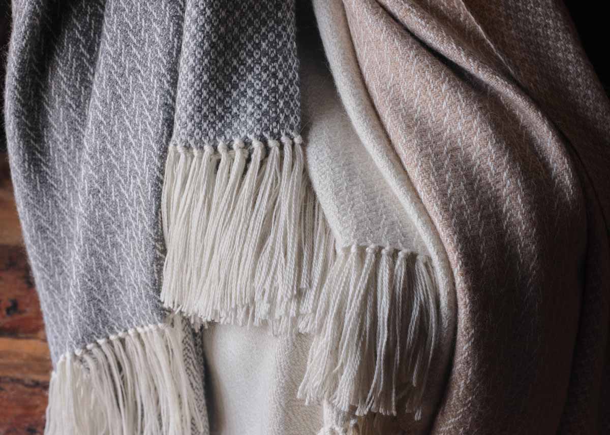 British alpaca wool throws made in Scotland by Araminta Campbell in grey, white and caramel