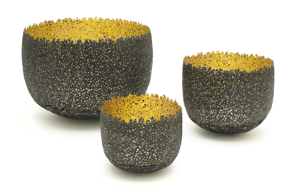 Eroded Bowls by metalsmith Claire Malet for AUTHOR Interiors' collection of unique and luxury gifts and homeware. Recycled tin can with gold leaf.