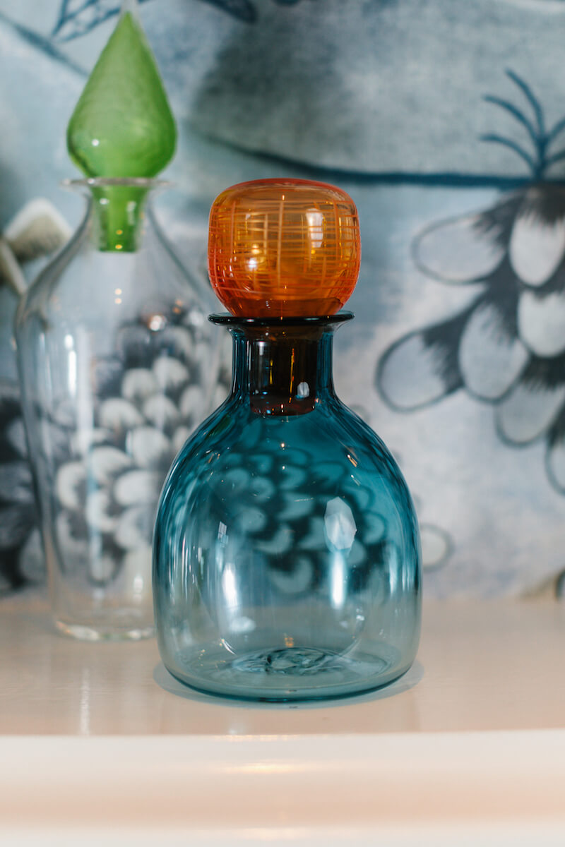 blue glass decanter with orange glass stopper handblown by Vicky Higginson for AUTHOR