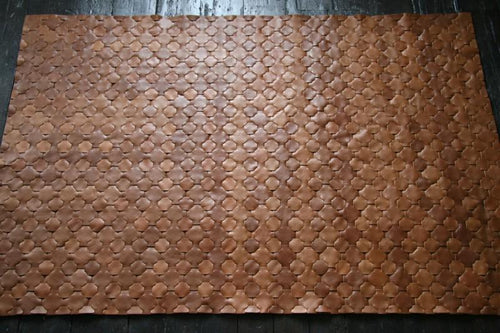 Reclaimed tan leather rug by Elvis & Kresse for AUTHOR Interiors' collection of luxury rugs