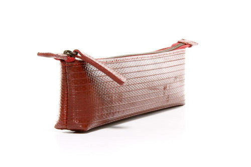 Red pencil case made from decommissioned firehose by Elvis & Kresse for AUTHOR Interiors' collection of sustainable luxury stationery made in Britain